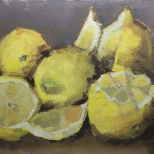 a still life of lemons arranged in tribute to Frida Kahlo's Melon painting