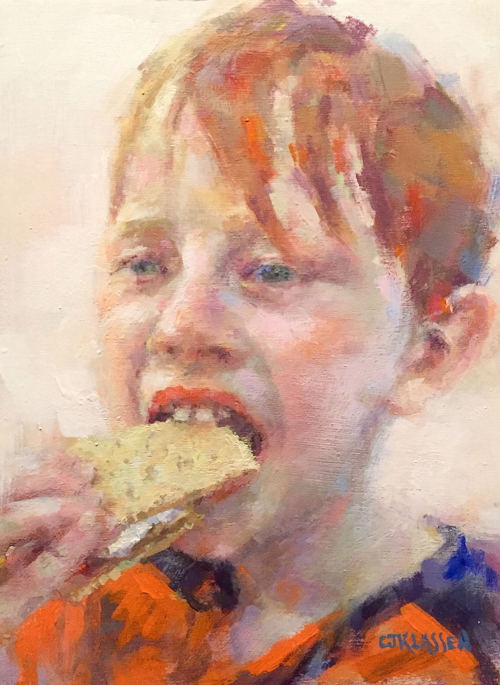young boy taking a big bite of a smore